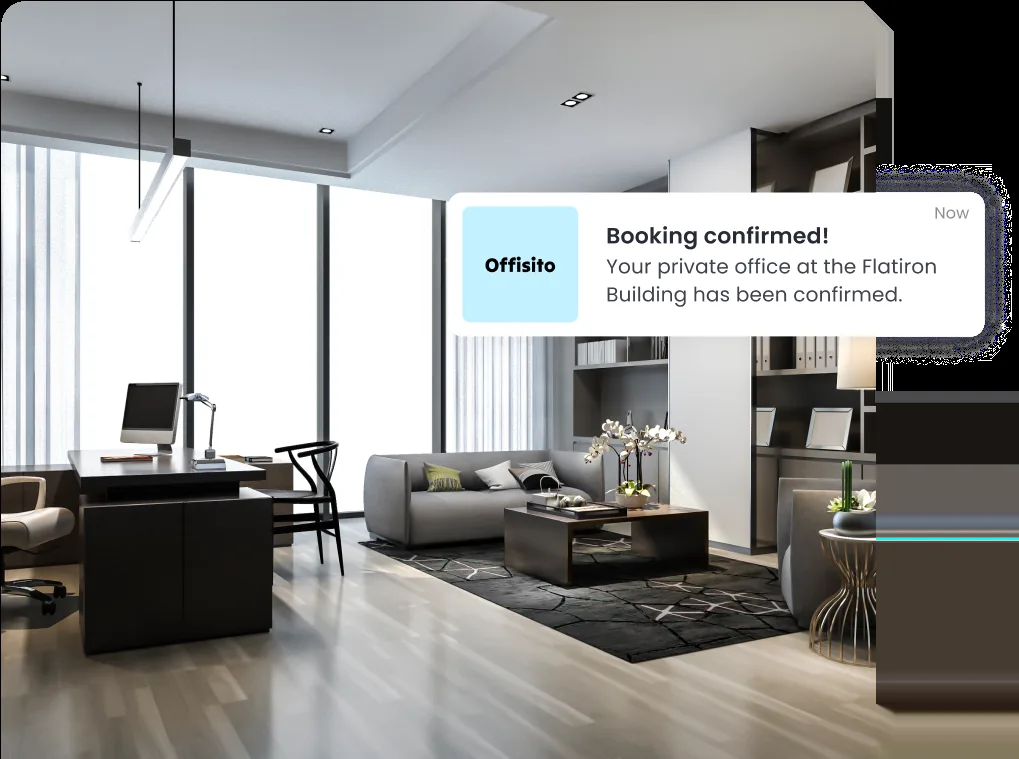 An office interior with a “Booking confirmed” notification