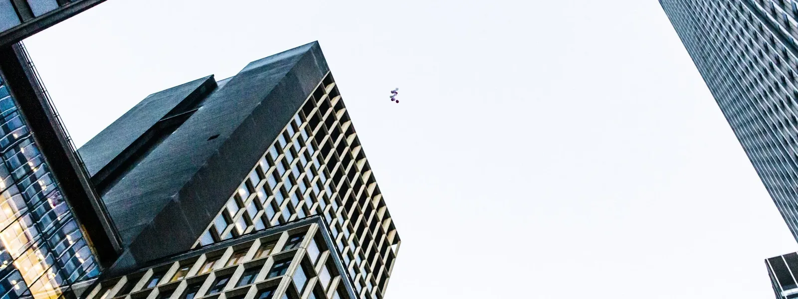 Looking up between glass towers