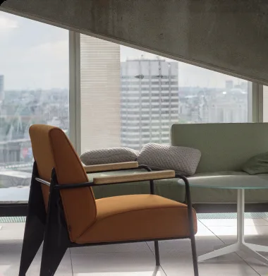 A luxury corner office with an orange lounge chair and city view